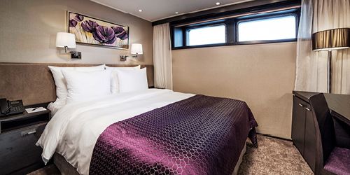 A stateroom on a river cruise boat.