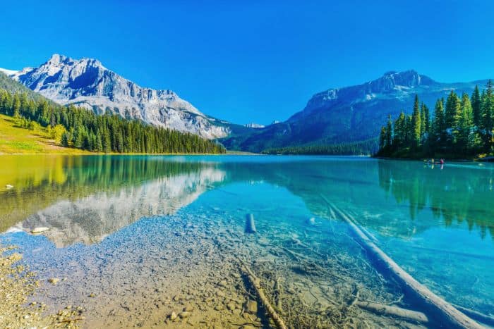 Towering mountains and an emerald lake