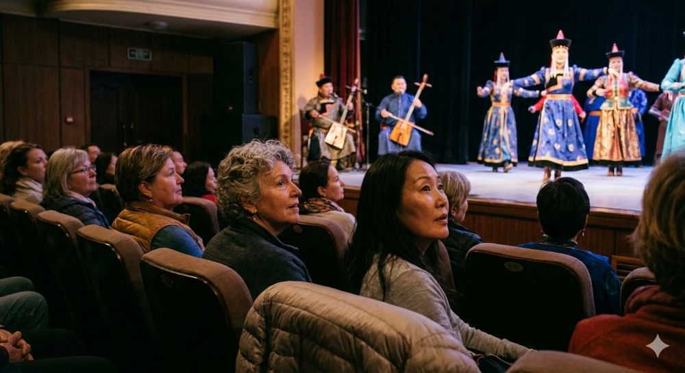 Diverse women over 50 watch a traditional Mongolian folklore performance in a theater.